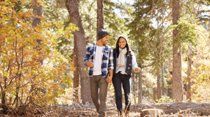 Couple walking with branded outerwear on