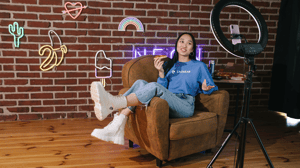 Influencer recording a video in a chair