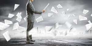 Businessman examining document in hands. Signing contract