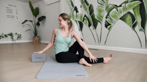 Woman doing yoga on yoga mat