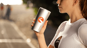 woman holding branded coffee mug